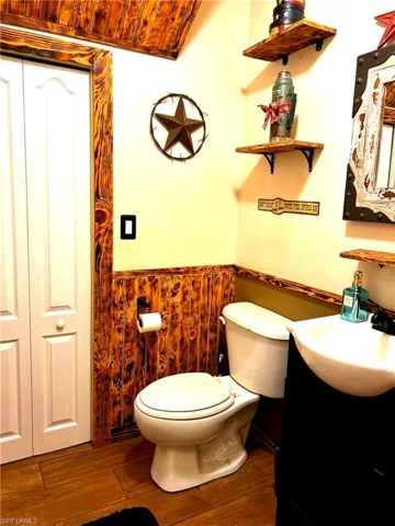 1/2 Bath downstairs with walk in closet.