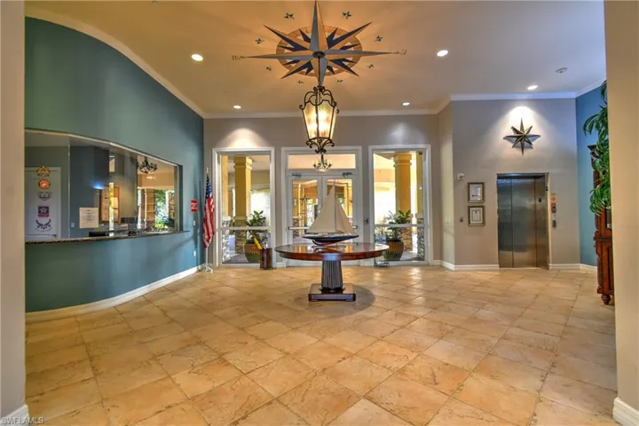 Clubhouse Entryway, Note Concierge Office To The Left and Elevator to Second Floor Amenities Including Weight Room with Machines, Aerobics Room, Steam Rooms, Showers, Billiards, Game Room, Etc,