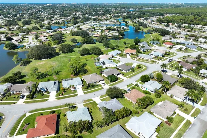 View of property location with a large body of water and nearby suburban area