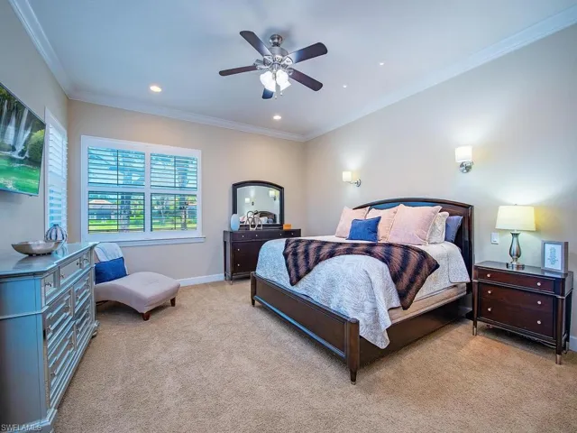 Bedroom featuring ornamental molding, light colored carpet, ceiling fan, and recessed lighting