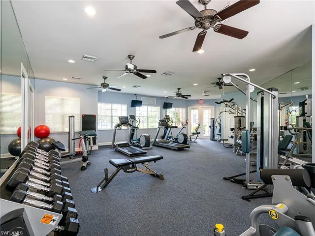 Exercise room featuring recessed lighting