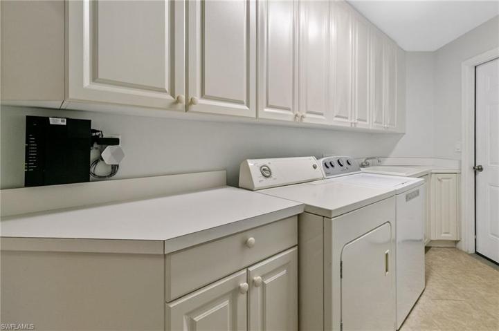 Laundry Area with cabinetry and sink