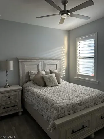 Bedroom featuring wood finish floors and a ceiling fan