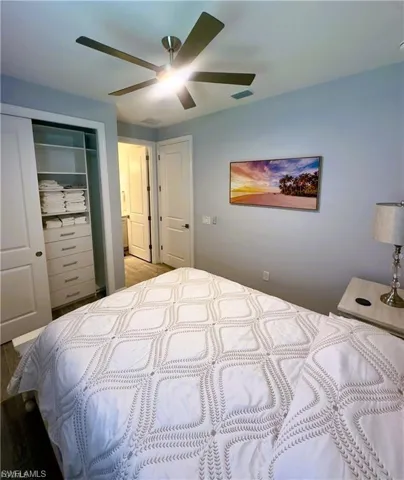 Bedroom with a closet and a ceiling fan