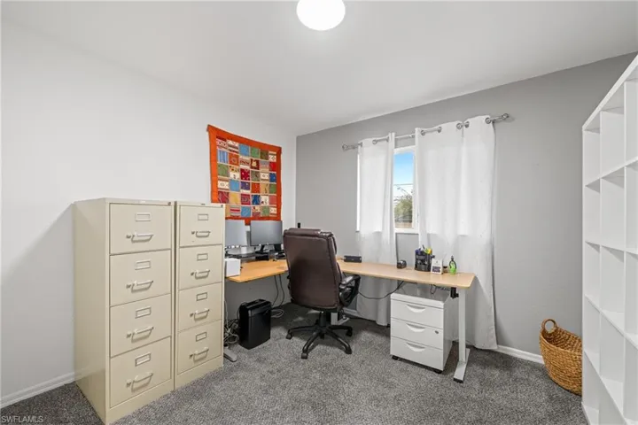 Office area featuring carpet flooring and baseboards