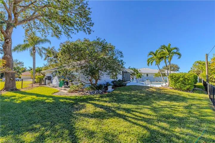 View of yard with a fenced in pool and a patio