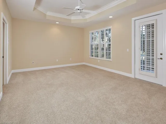 Start and end each day in the large primary bedroom with tray-ceiling, plush carpeting and access to the sunroom.