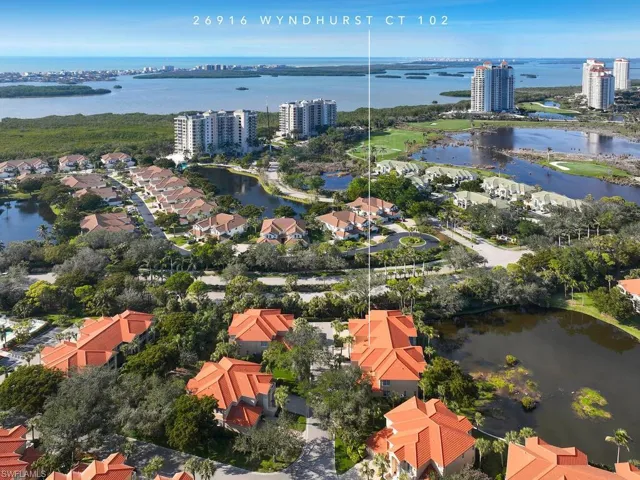 View of home from above with the Estero Bay and The Gulf of Mexico in the distance.