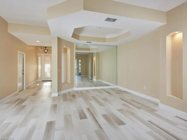 Impress guests with a formal dining area boasting wall and ceiling detail.