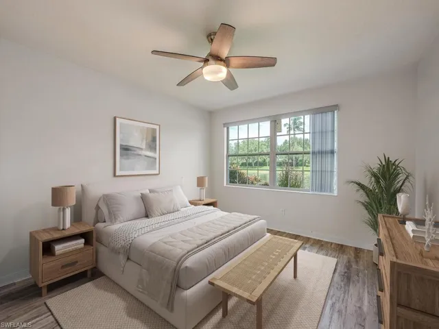 Virtual Stated Primary Bedroom with wood finished floors and ceiling fan