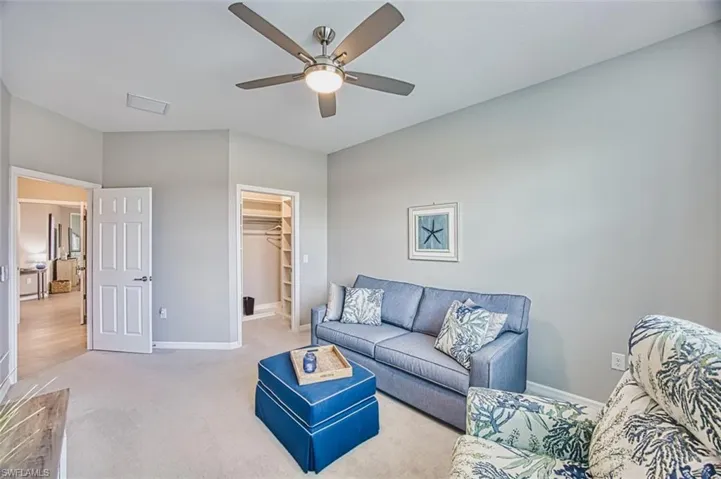Bedroom #3 featuring carpet flooring and a ceiling fan hide a bed and tv