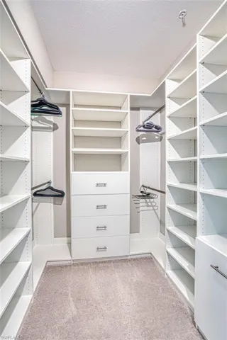 Spacious closet featuring Closet Factory installation.  Plenty of room for shoes and clothes