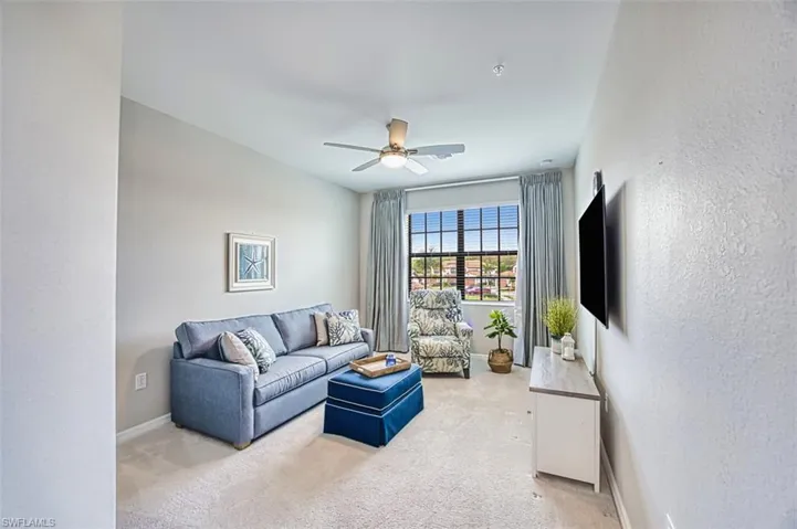 Guest room #3 being used as a den with a pull out sofa and tv along with a walk in closet with lots of storage