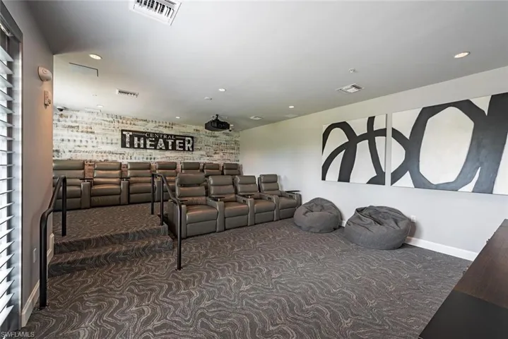 Home theater room featuring carpet
