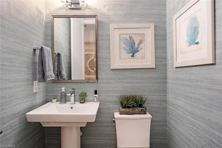 Powder Bathroom with designer wallpaper