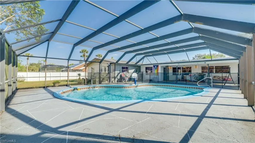 View of pool with a patio area, a lanai, and a sunroom