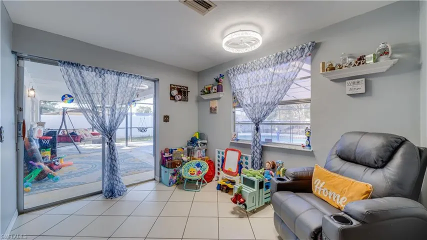 Game room with tile patterned floors