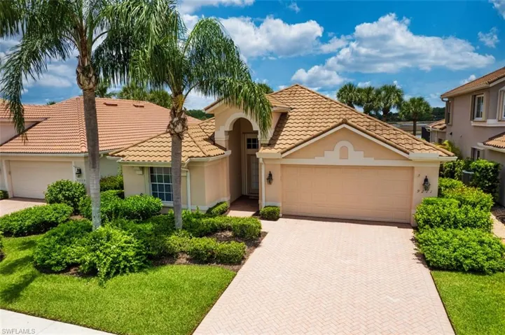 Mediterranean / spanish-style house featuring stucco siding, an attached garage, decorative driveway, and a tiled roof