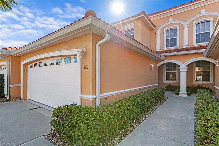 2-car attached garage, sidewalk leads to entry