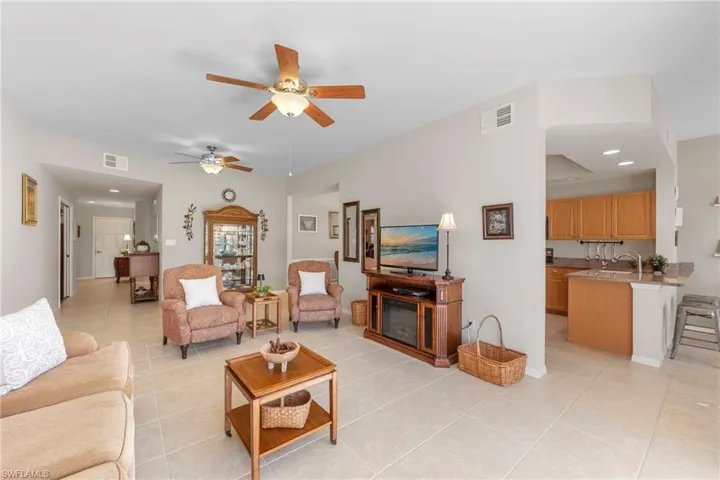Light neutral tile flooring throughout main living areas