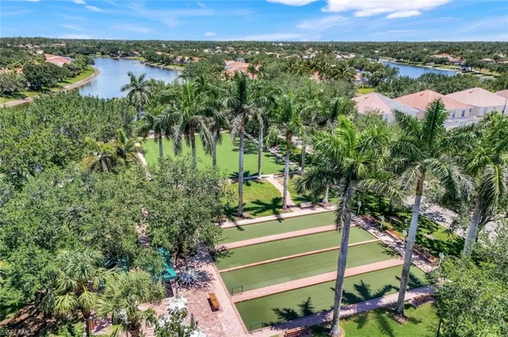 View of property location featuring a nearby body of water and a tree filled landscape