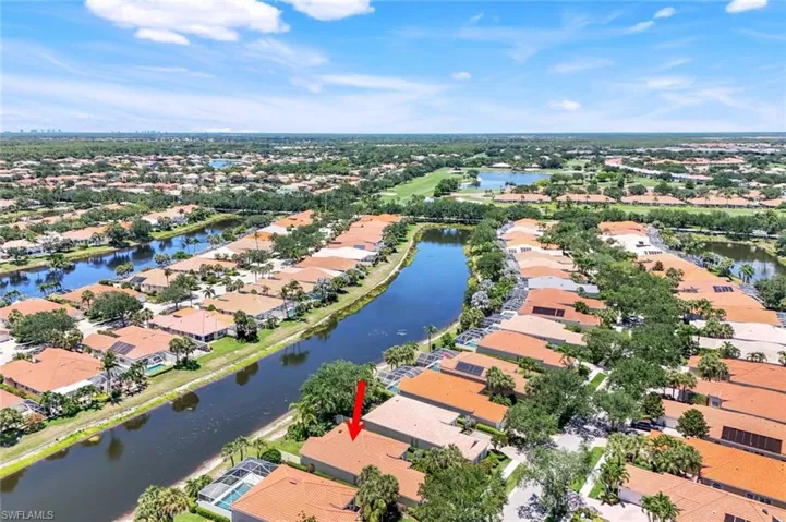 Aerial perspective of suburban area with a large body of water