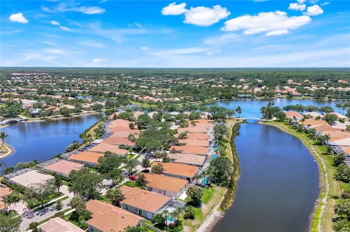 Aerial view of residential area featuring a large body of water