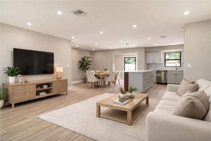Stagged open concept  living dining and kitchen area