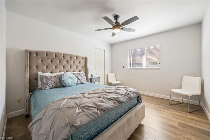 Bedroom featuring wood finished floors and a ceiling fan
