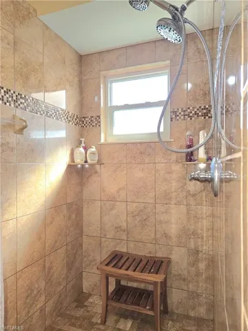 Bathroom with tiled shower
