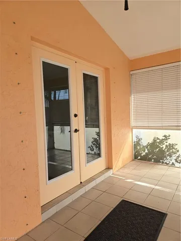 Doorway to property featuring french doors