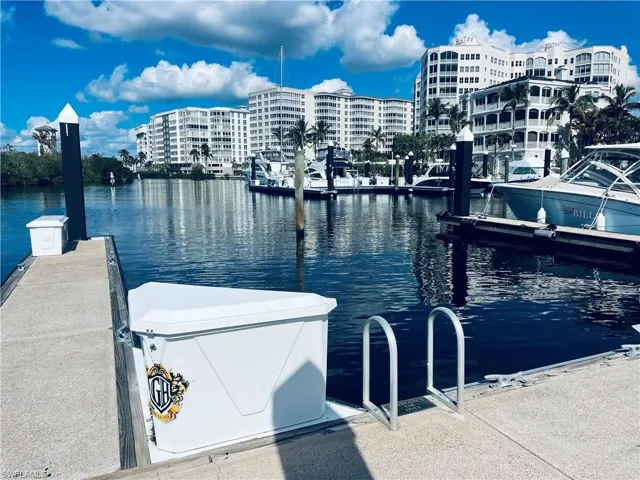 Dock area featuring a water view