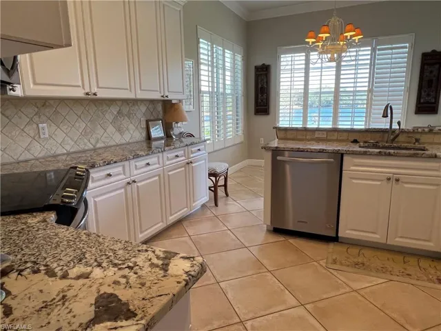 Kitchen and breakfast nook all with a magnificent view. Pantry not visible.