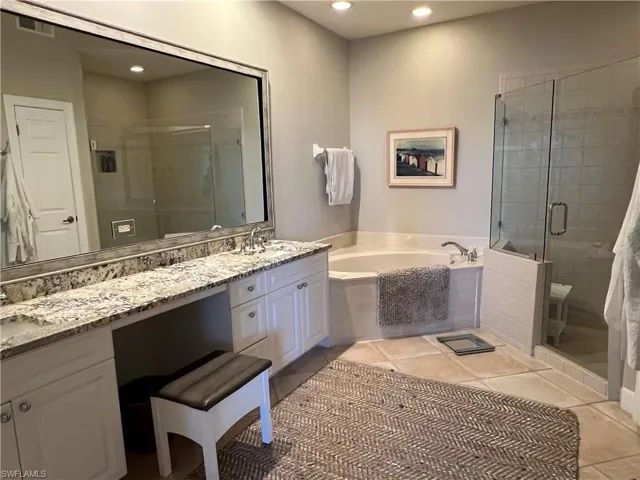 Master bath...soaking tib, separate shower, dual sinks and vanity seating