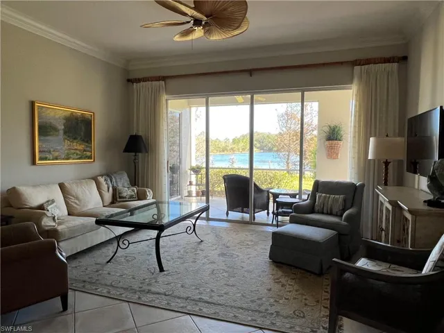 Large great room, sliding doors leading to lanai. Ceramic tile floor installed on diagonal.