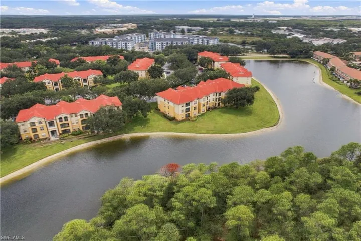 Waterfront multi-story buildings with red tile roofing