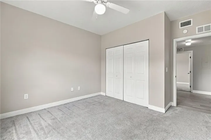 Neutral wall color and gray carpeting