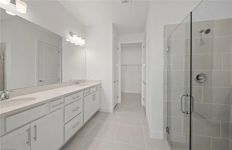 Master bathroom - walk-in shower, dual sinks, walk-in closet