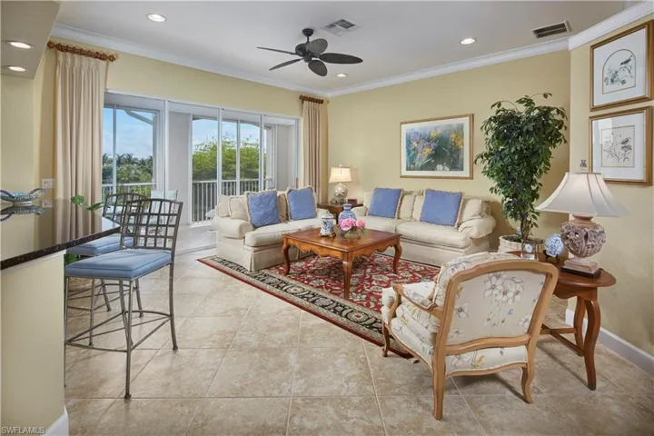 This expansive living area, open to the dining room and eat in kitchen, is the perfect space for friends and family to gather together.