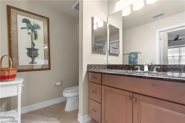 Primary bathroom with granite counters