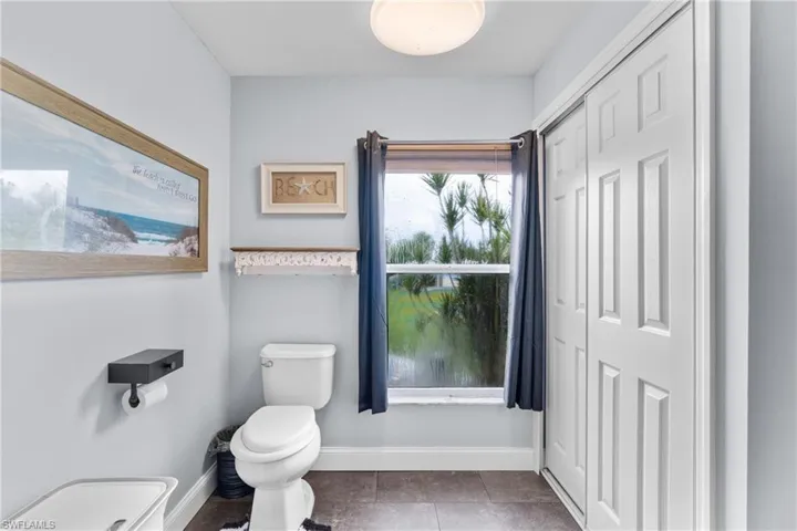 Bathroom with toilet and tile patterned floors