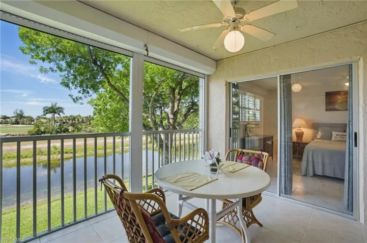 REAR ELEVATION AND LANDSCAPED VIEWS WITH MATURE TREES AND VEGETATION