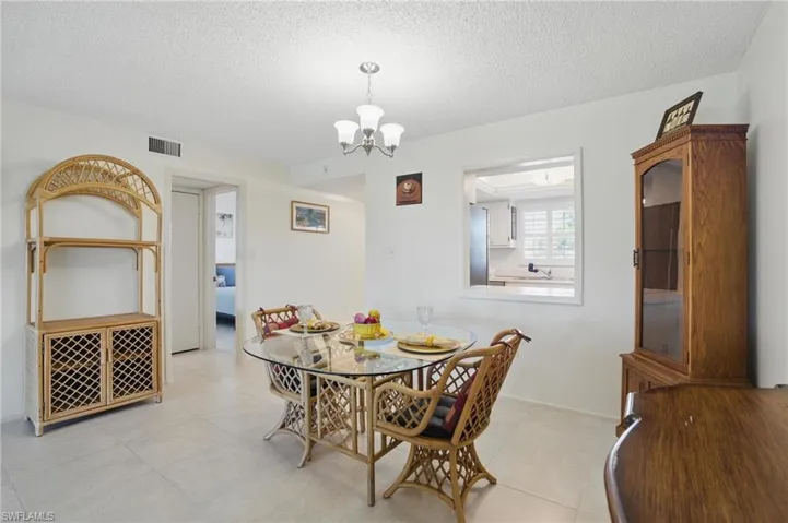 LIVING AREA WITH UPDATED TILE FLOORING