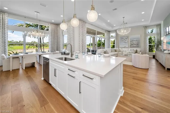 Kitchen featuring a chandelier, light wood-style floors, open floor plan, and recessed lighting