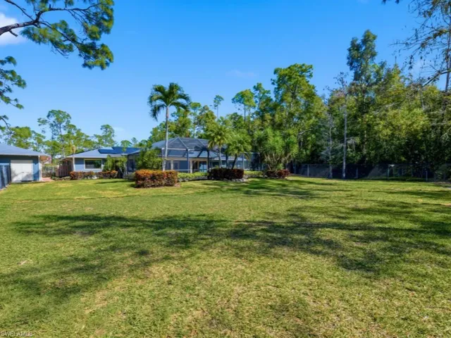 View of yard featuring a sunroom