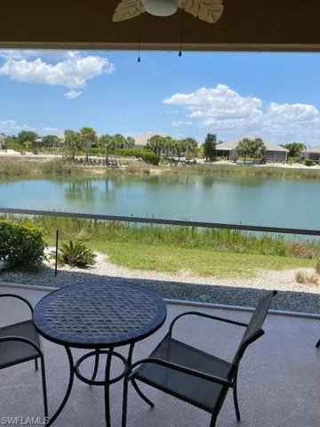 View of lanai / terrace featuring ceiling fan and a pleasant water view