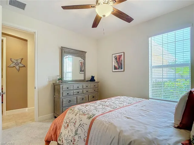 Comfortable guest Bedroom with ceiling fan