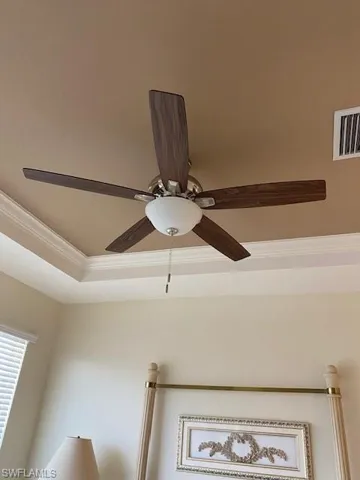 Master Bedroom details featuring ceiling fan and ornamental molding