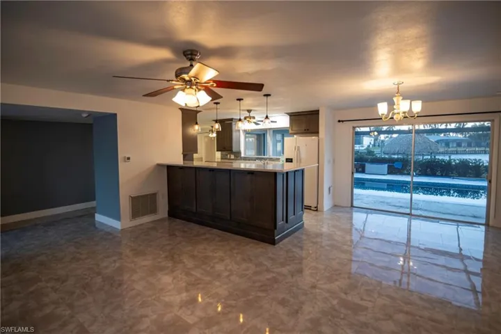 Spacious interior featuring reflective tile flooring throughout