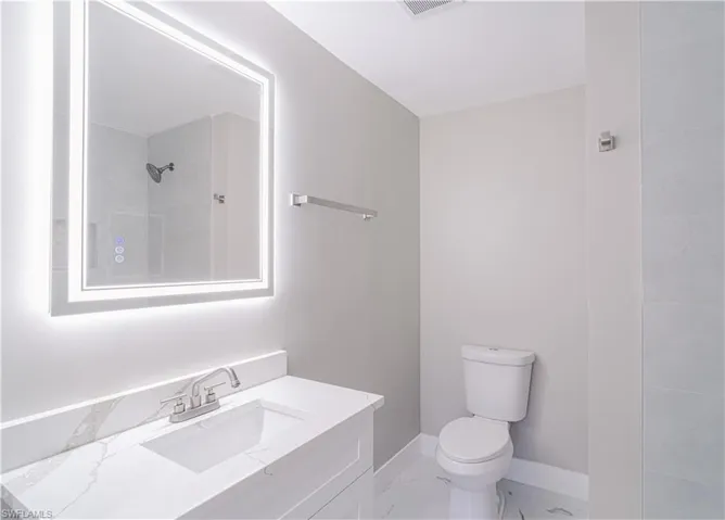 Full bath featuring vanity and a shower